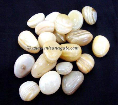 Manufacturers Exporters and Wholesale Suppliers of Yellow Banded Tumbled Stone Khambhat Gujarat